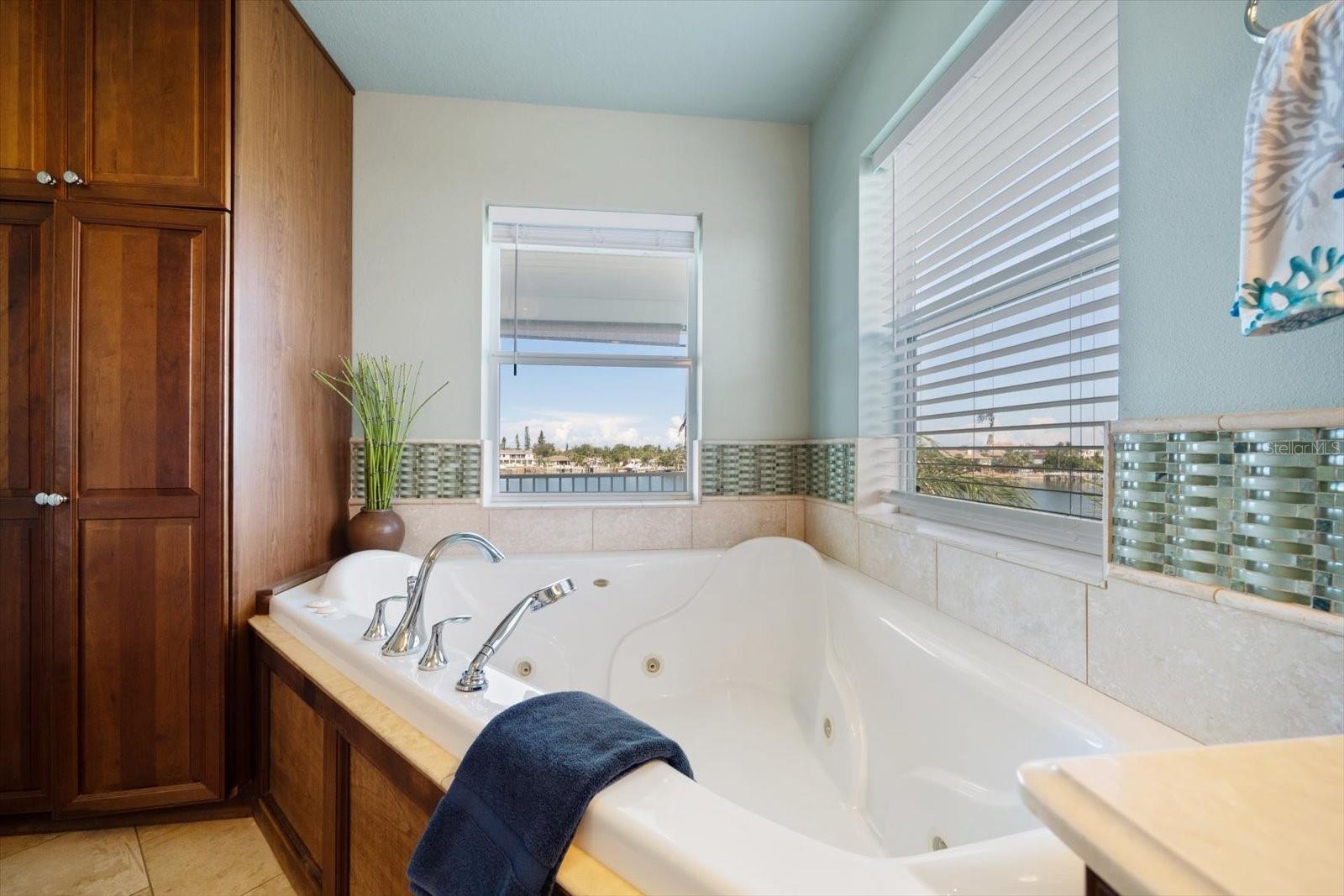 Relax in the very private primary bath jetted tub.