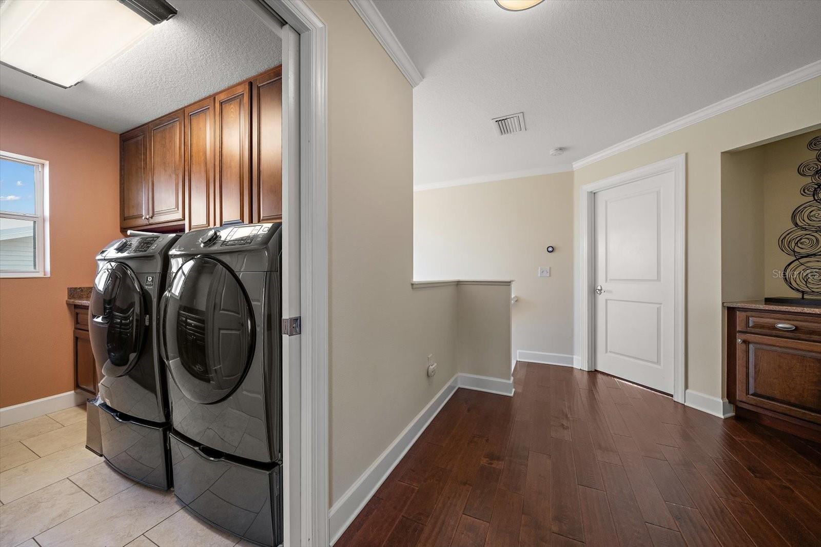 Laundry area on third level accessed by stairs or elevator