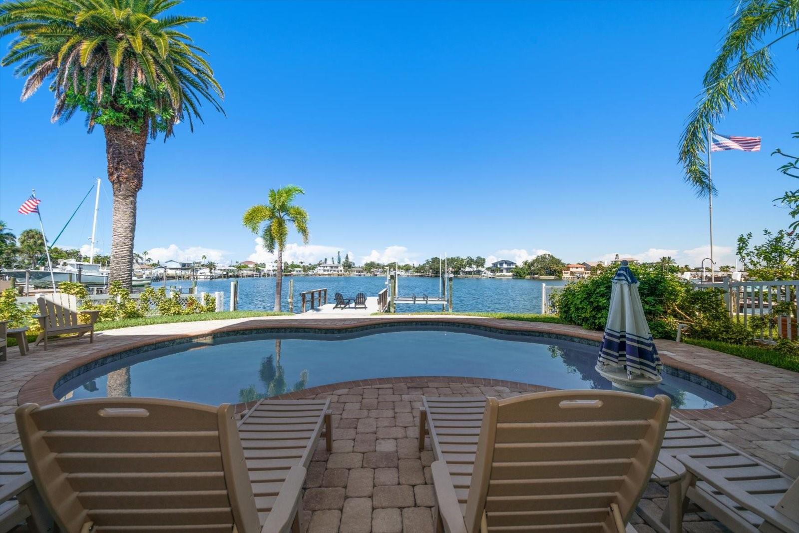 Tranquil setting lounging by the pool and waterfront.