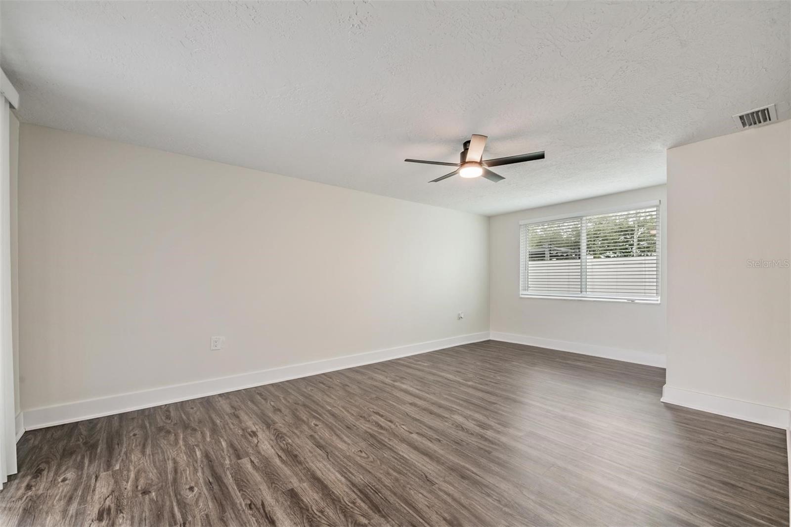 Primary Bedroom with sliders to the patio.