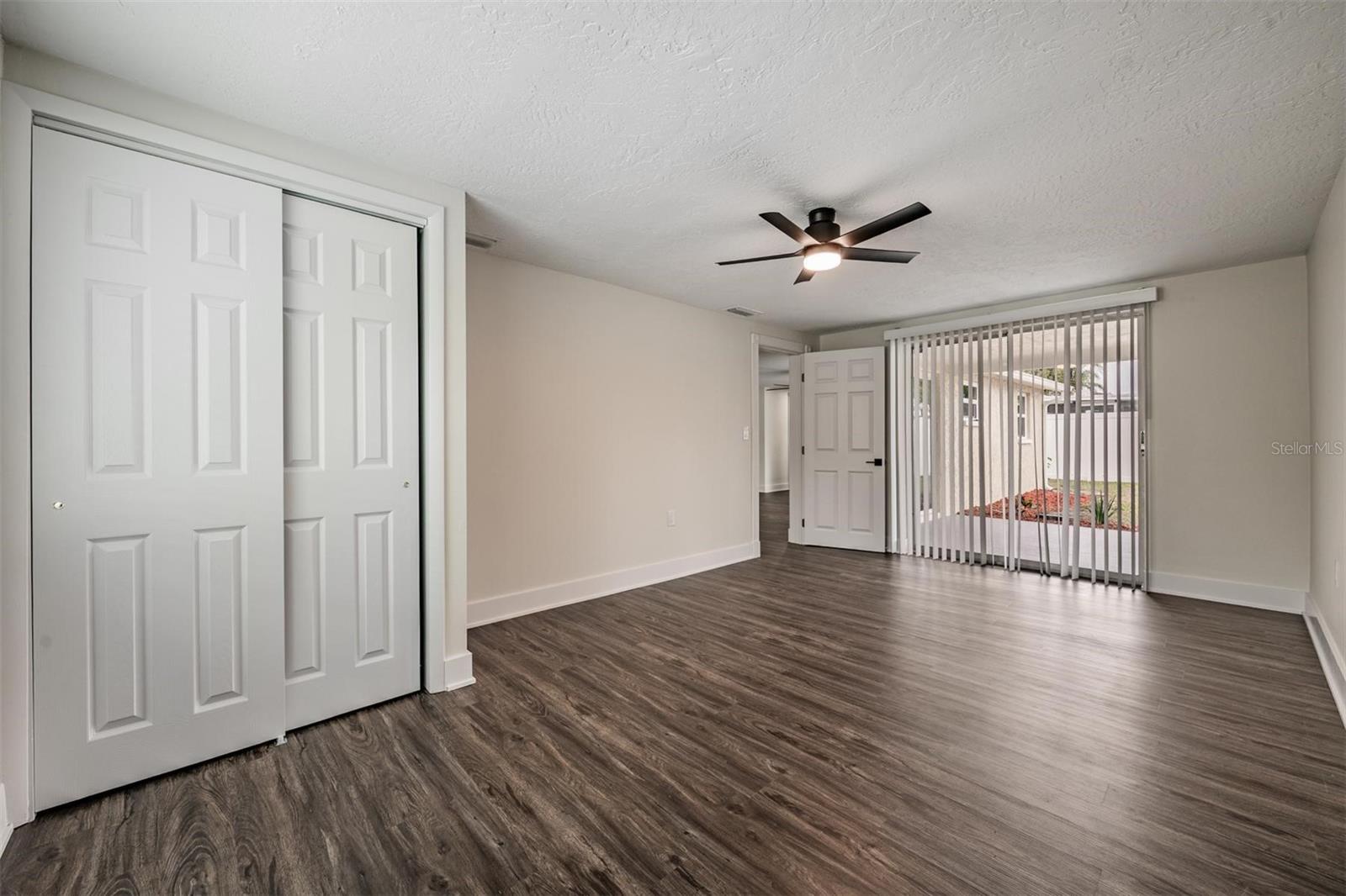 Primary Bedroom with sliders to the patio.