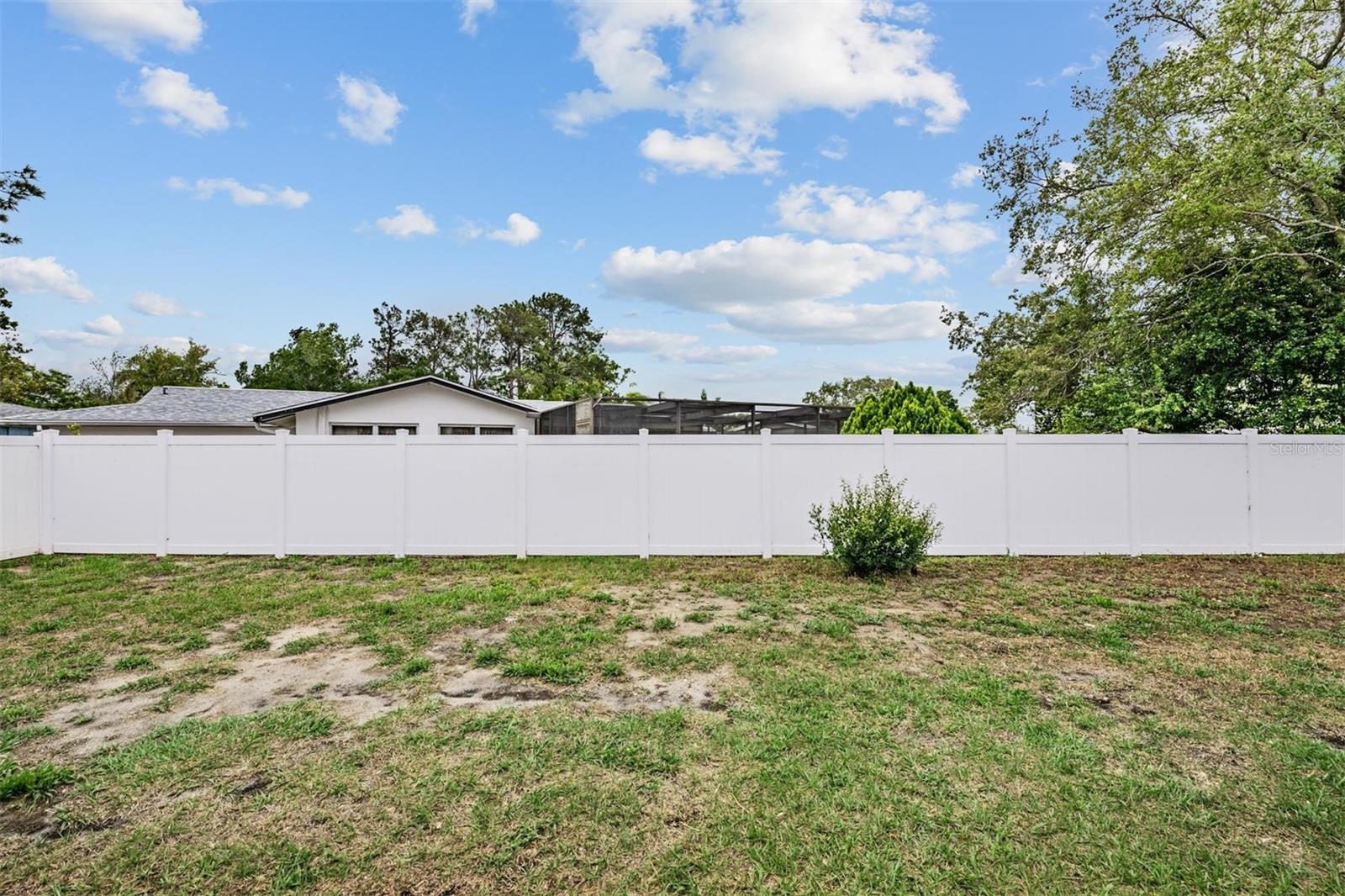 Backyard (0.24 acres) with newer PVC fencing