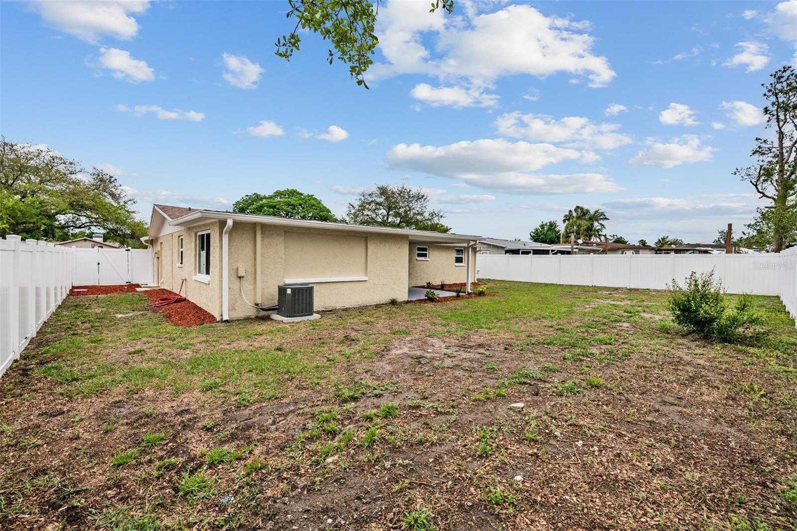 Backyard (0.24 acres) with newer PVC fencing