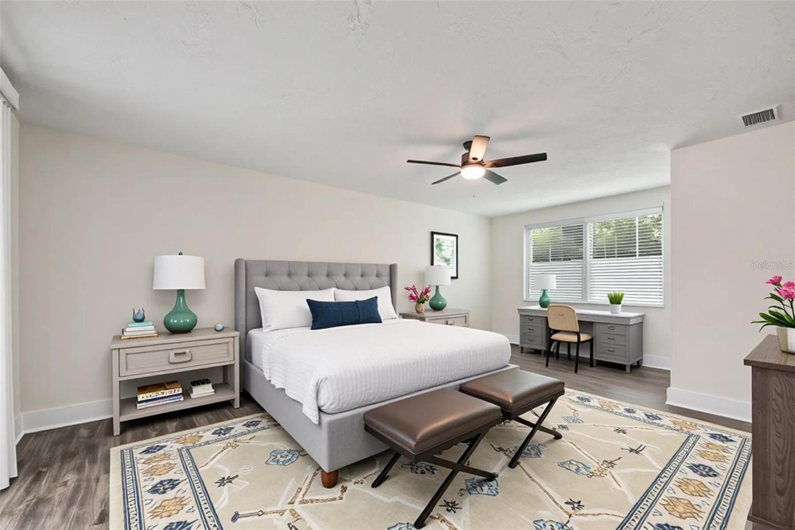 (Staged) Primary Bedroom with slider doors