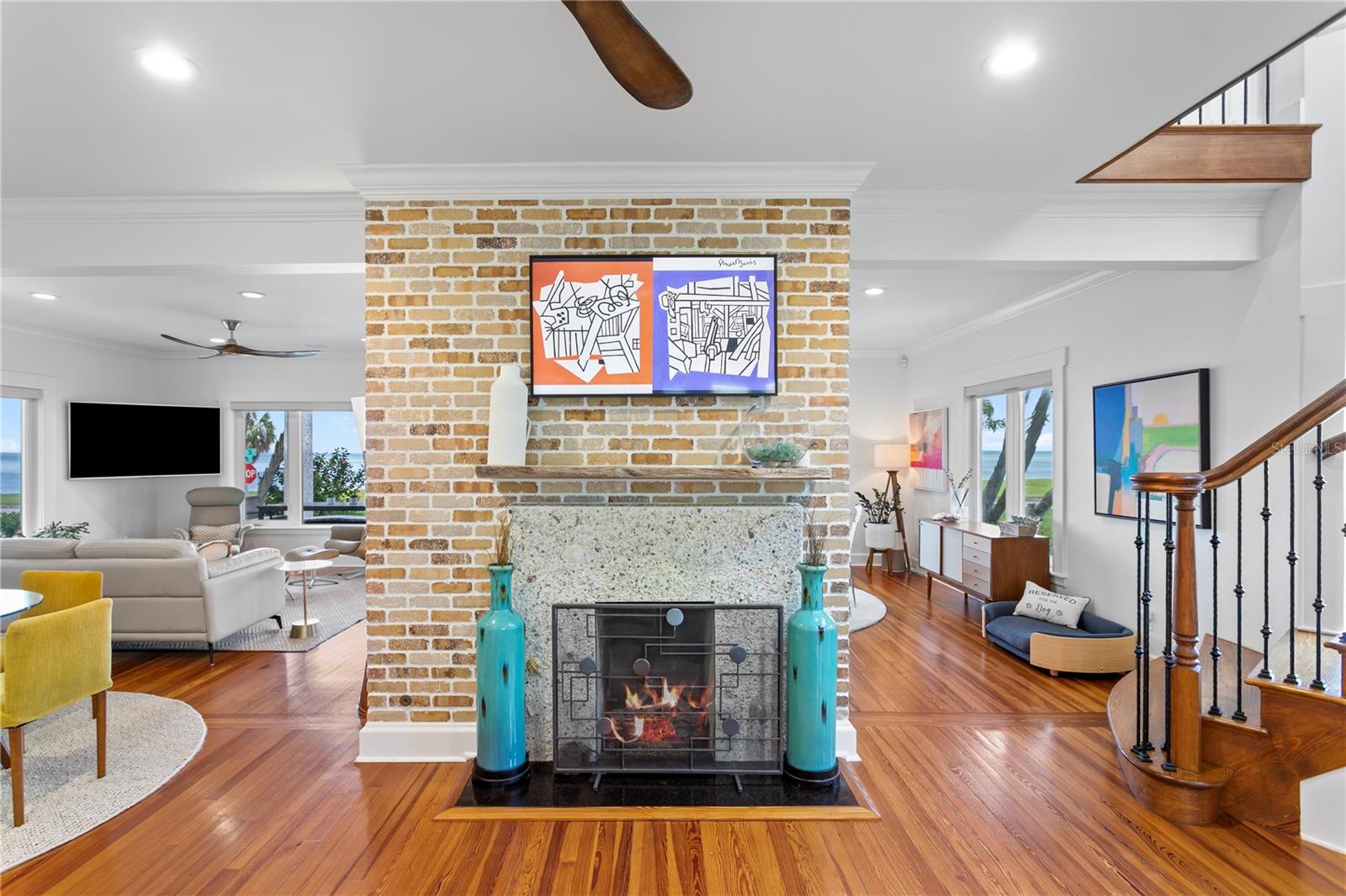 Double sided brick fireplace with tabby stucco.
