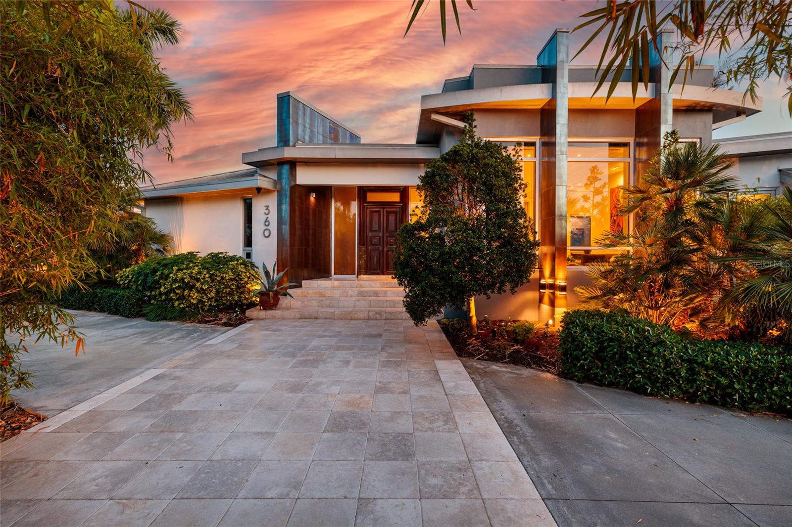 Sunset glow surrounds your luxury waterfront home