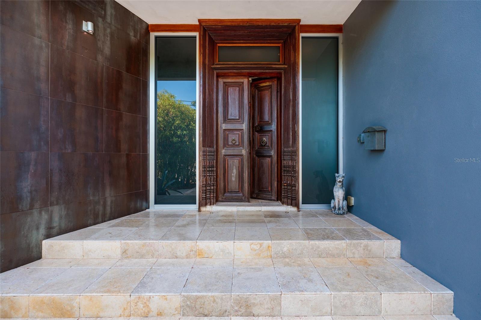 Elegant front entrance with custom double doors and refined architectural detailing