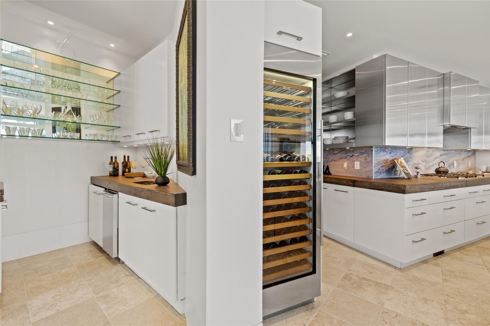 Butler's pantry with prep sink and ice maker.