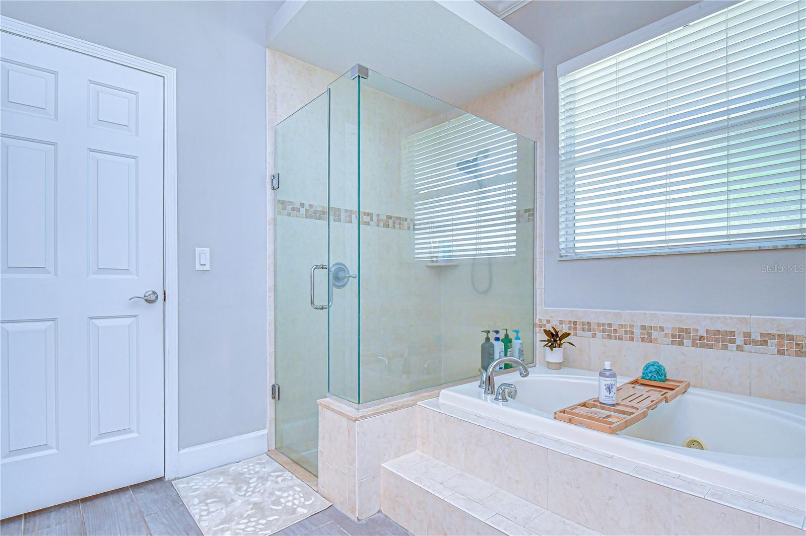 Garden tub and separate tiled shower.