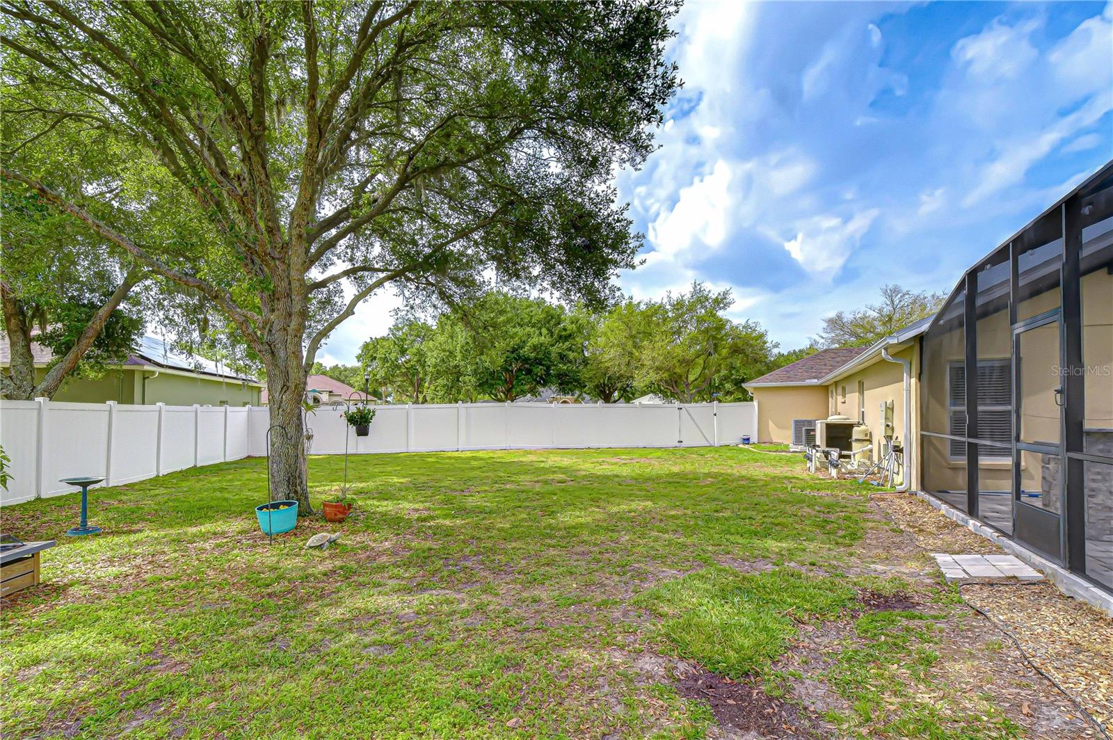 Expansive fenced yard with room for RV/boat storage.