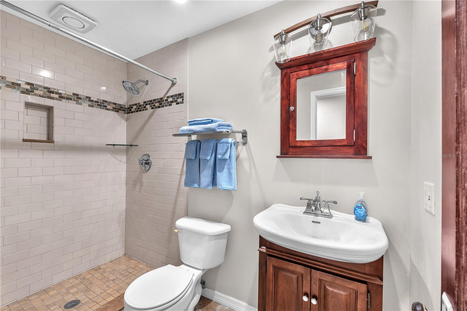 Guest Bathroom next to Family/TV room and 2nd downstairs bedroom.