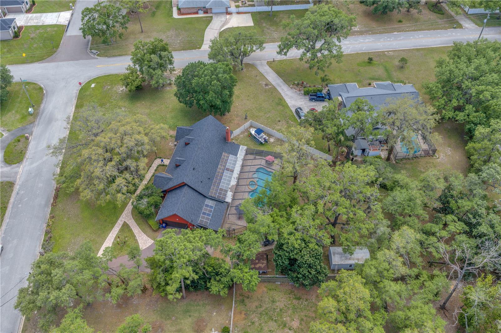 Recent upgrades provide peace of mind and energy efficiency, including a new roof (2023), upgraded breaker box, new septic drainfield (2022), and freshly resurfaced pool marcite (2025). With 32 solar panels already installed, enjoy significantly reduced electric bills—keeping summer costs under $250 per month.