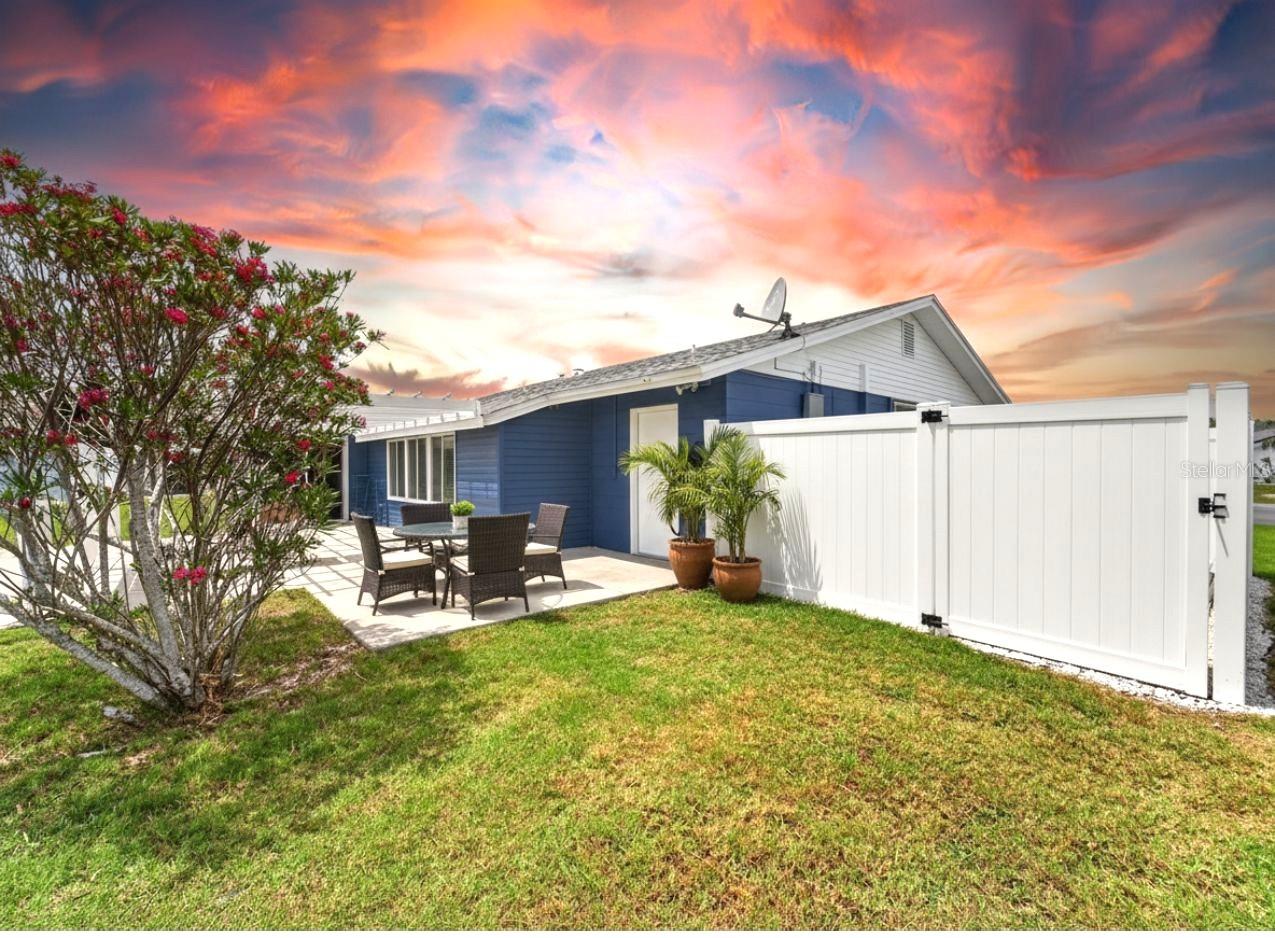 This photo includes virtual patio furniture. How nice to live in a neighborhood that allows fences.