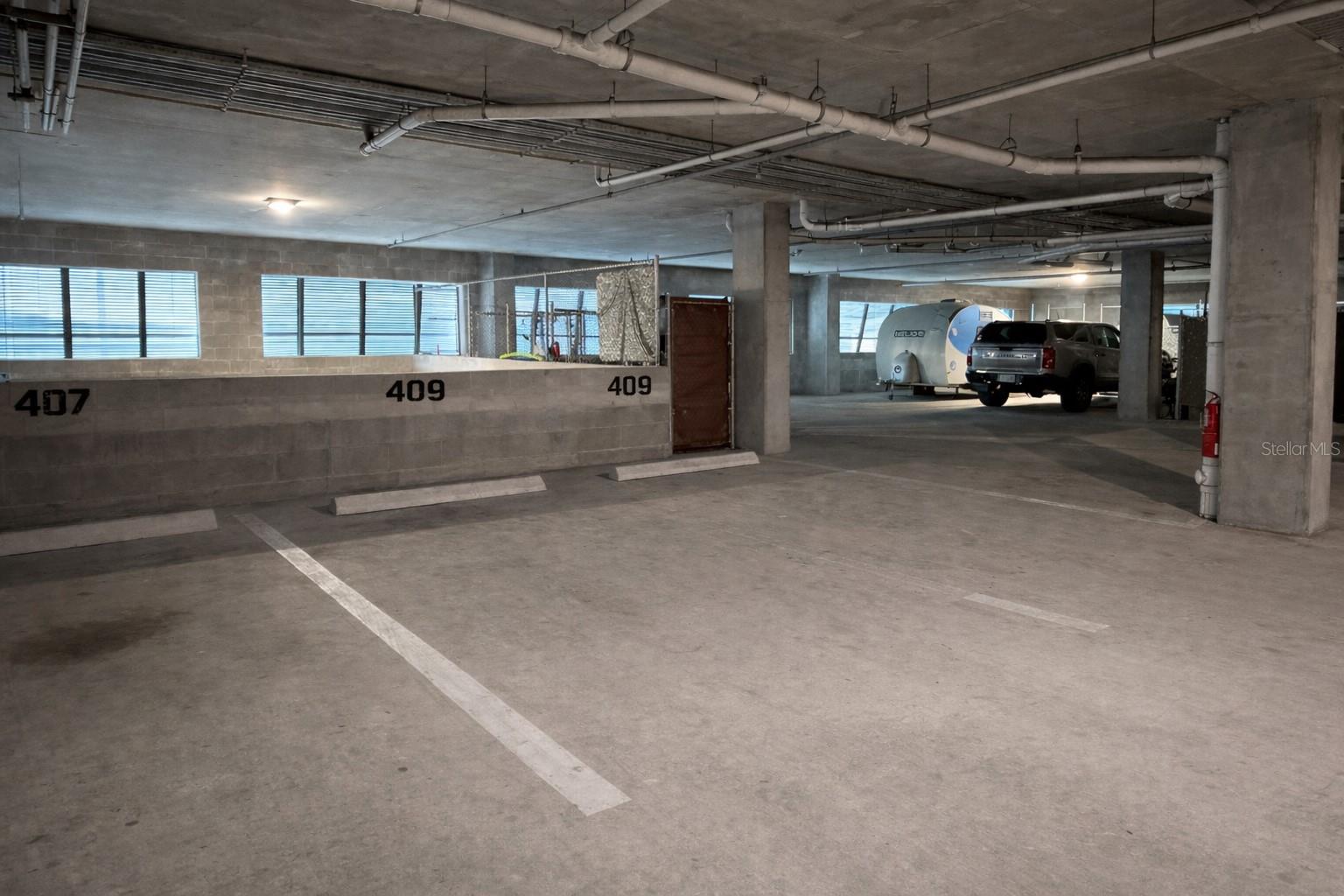 Two Assigned Parking Spots, approximately 45 feet to private 6'x5' storage