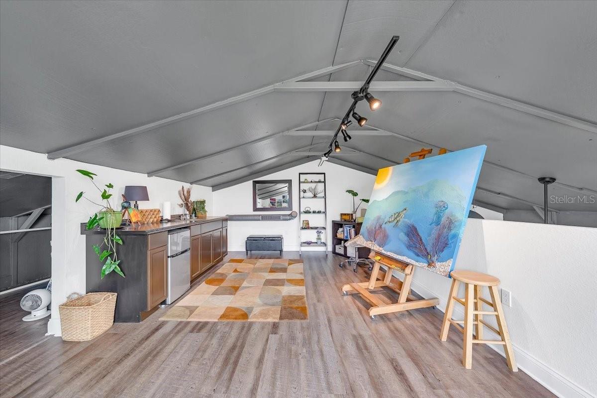 Private loft space for lounge or creative use.