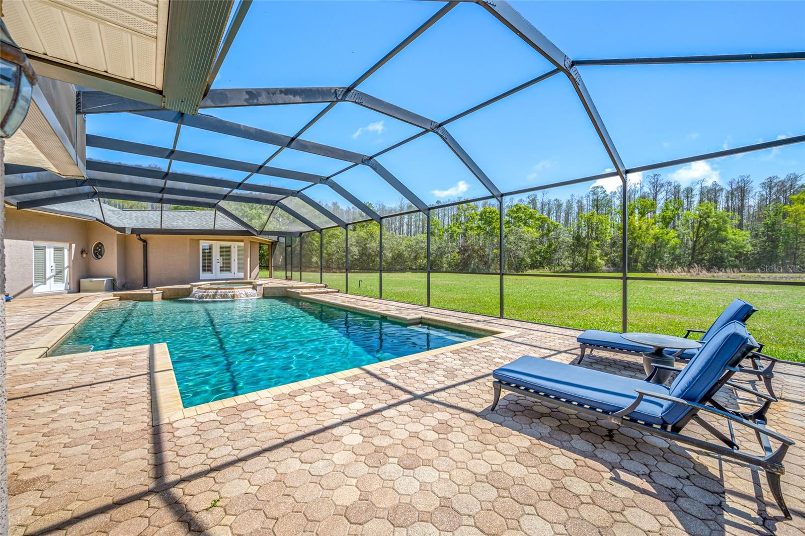 pool with view of backyard