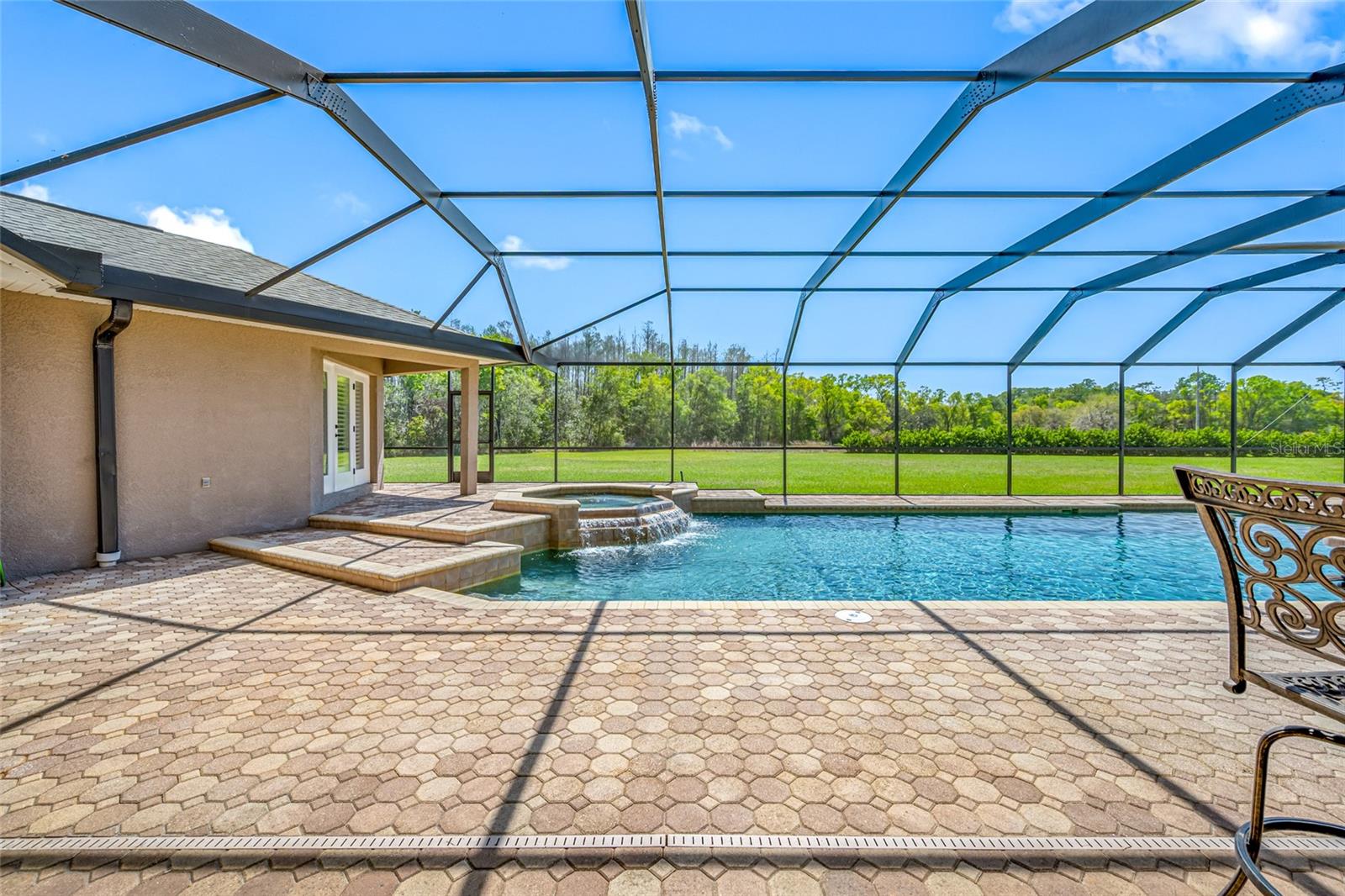 pool with view of back yard