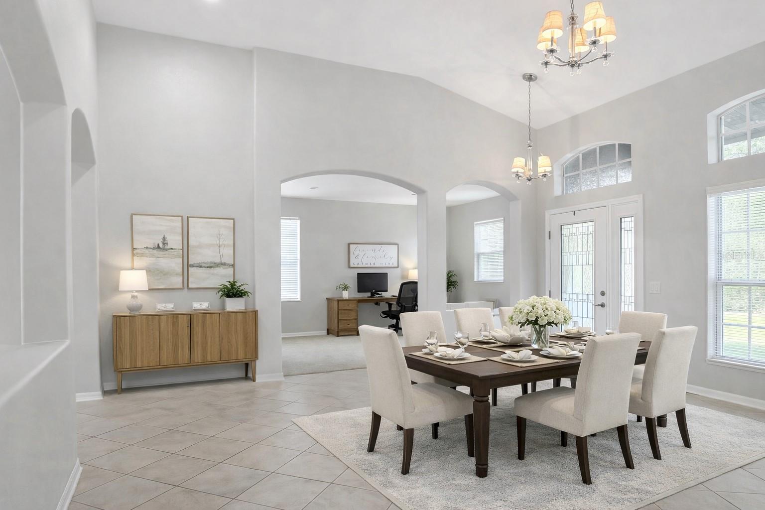 Formal dinning, family room and entry- virtual staging shown