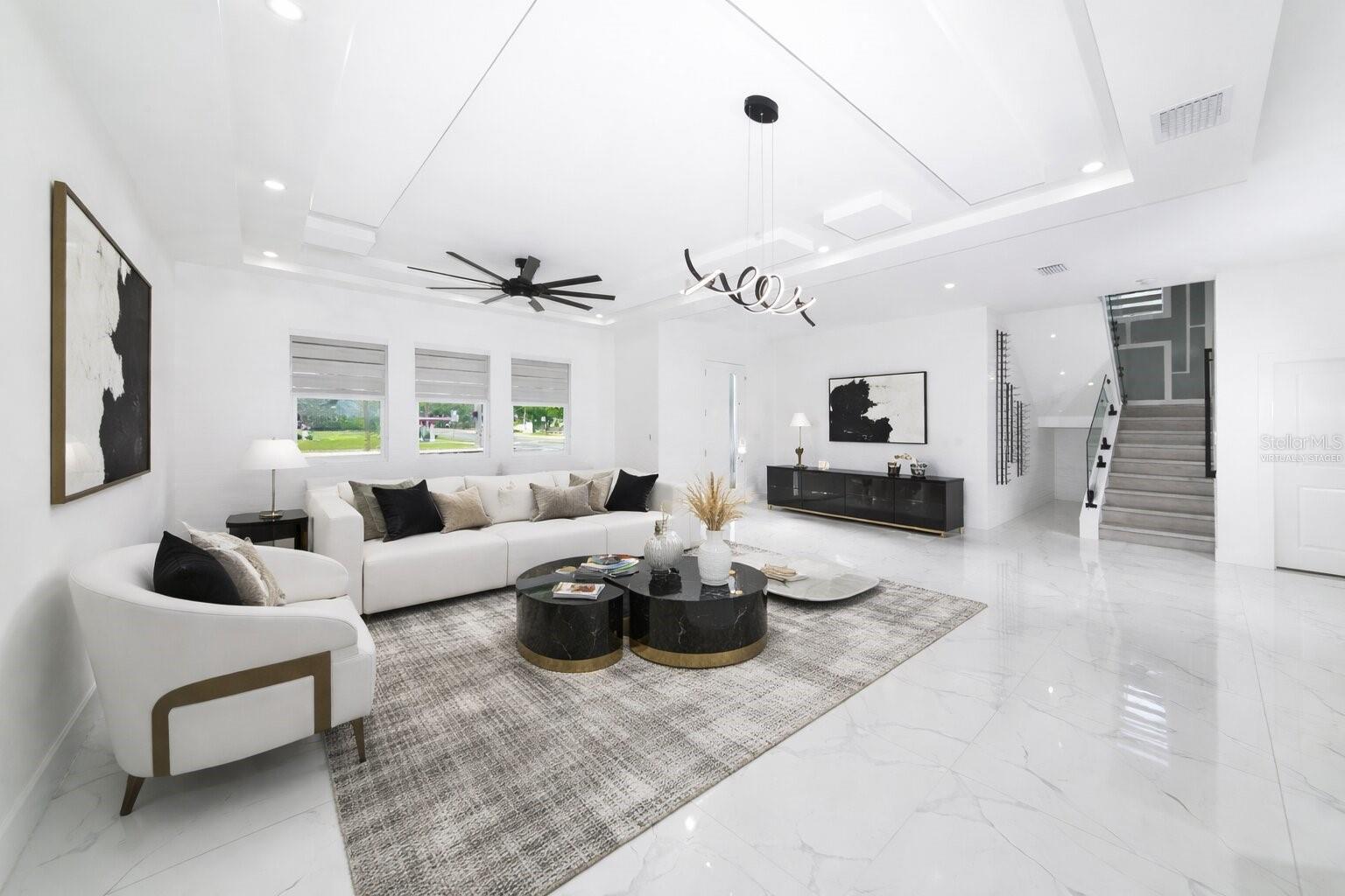 Virtually Staged Entrance and Living Room with Stairs