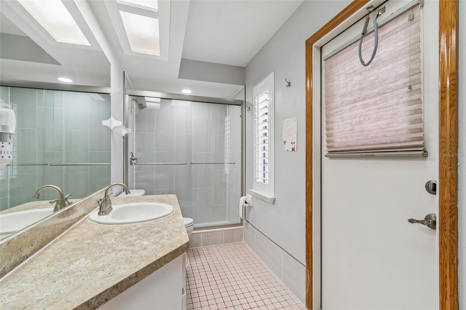 Second bath - renovated shower - pool access