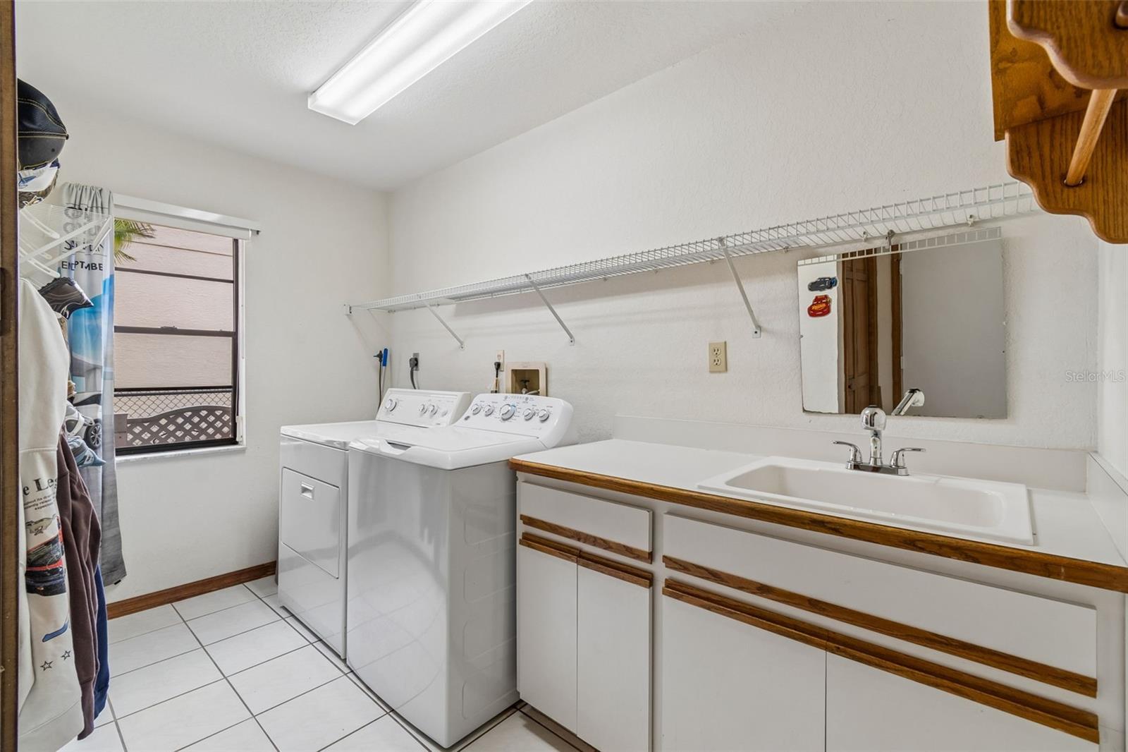 Laundry with sink, shelving