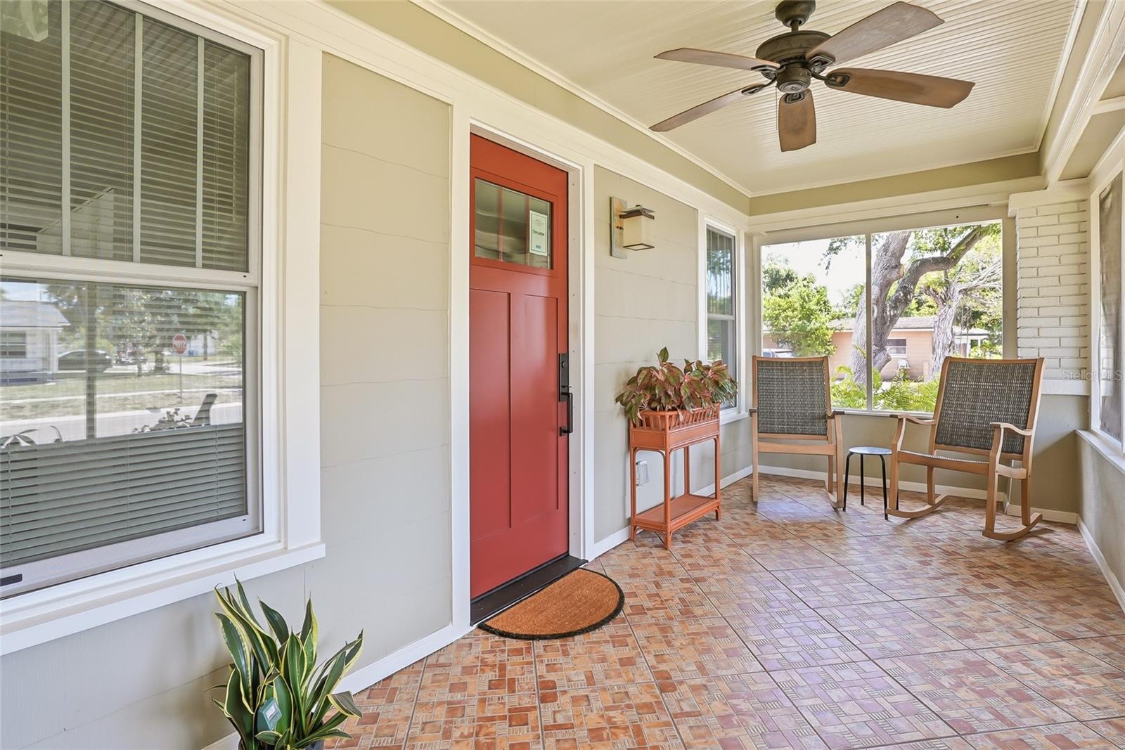 Relax on the inviting screened front porch, where rocking chairs and gentle breezes create the perfect setting.