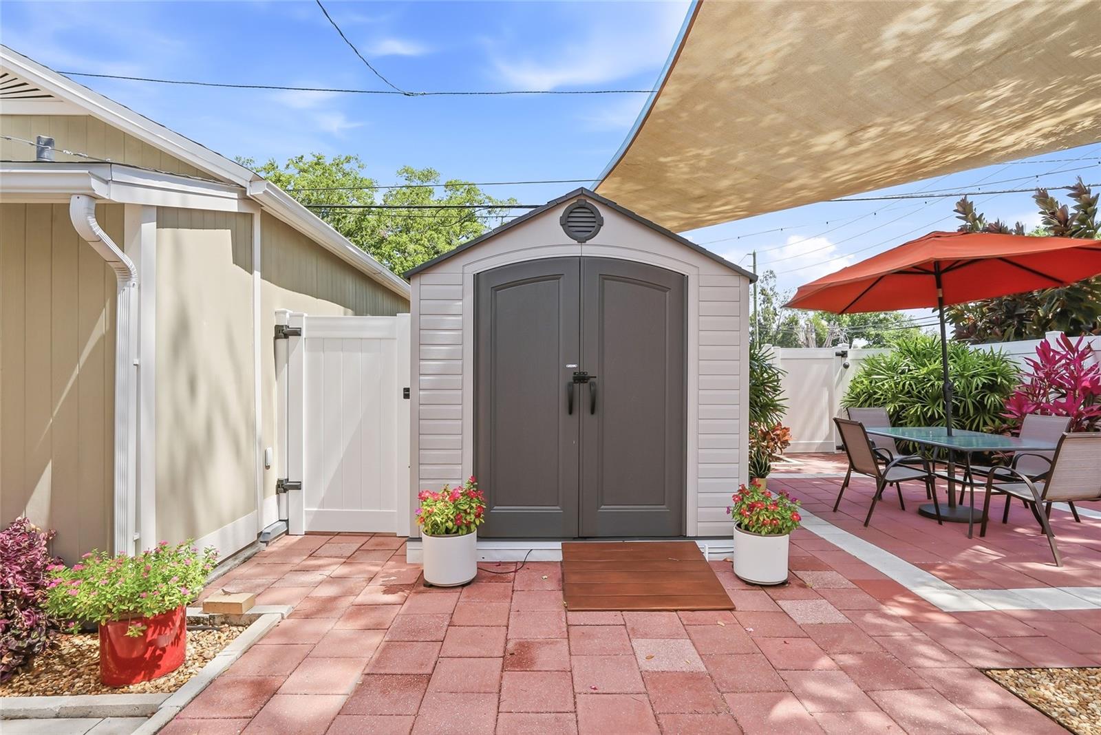Functionable shed to organize all of the gardening tools and supplies.