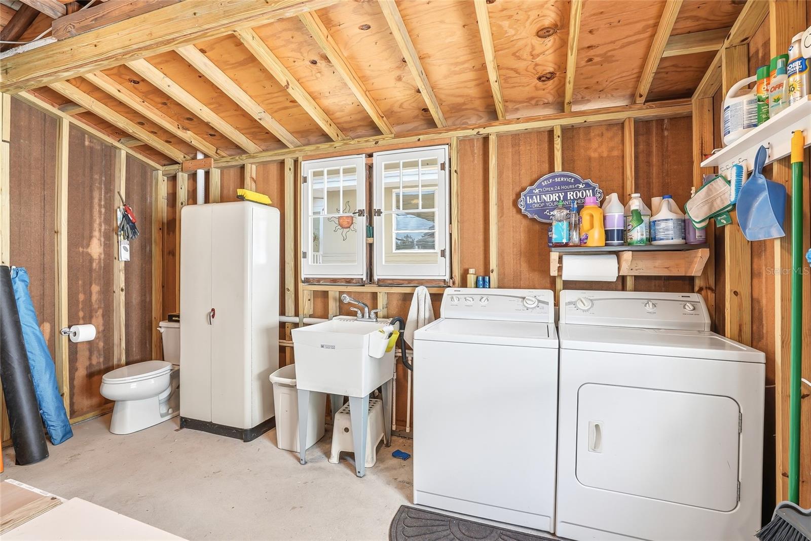 Laundry room located in the detached garage.