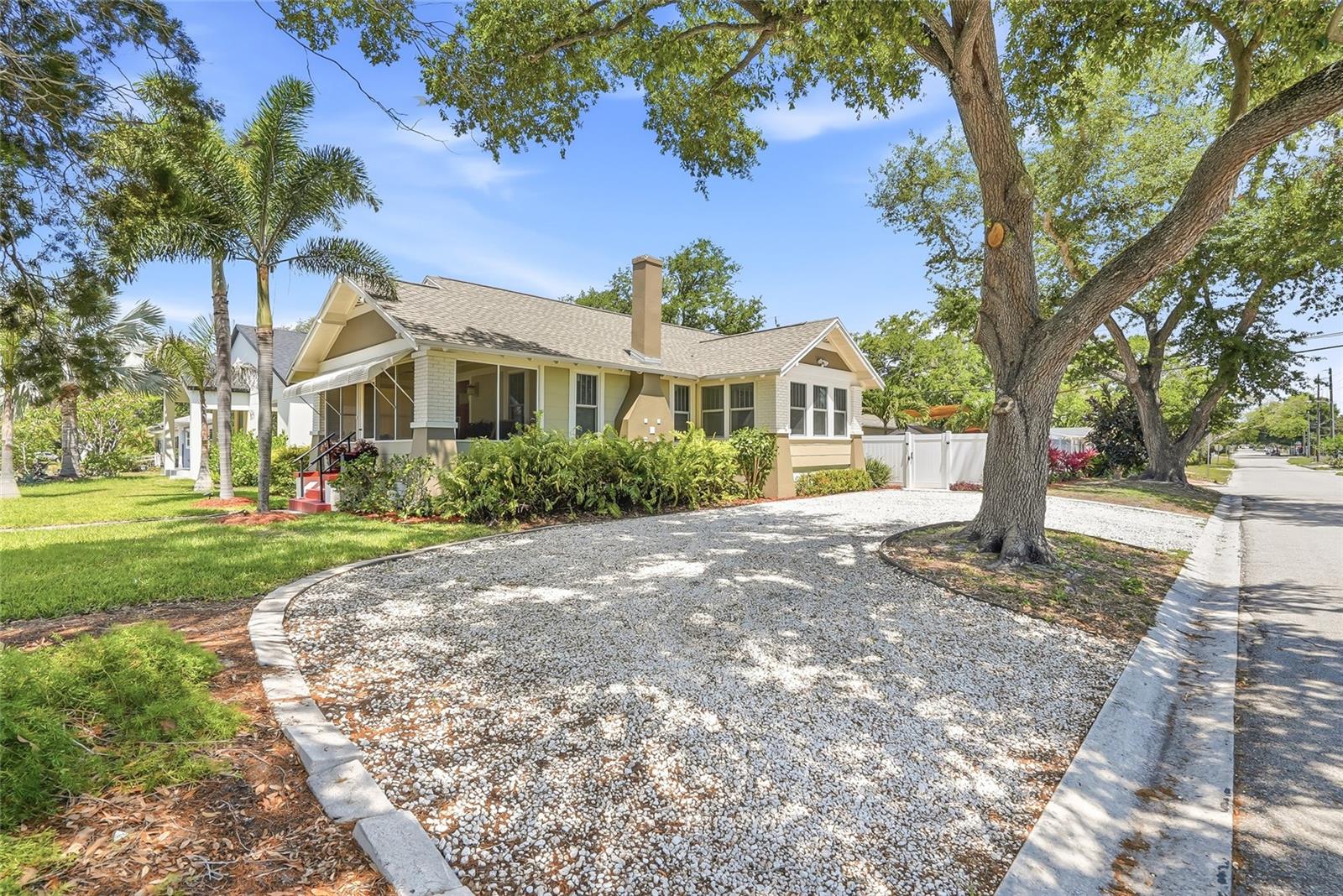 U-shaped driveway along the side of the home provides plentiful of parking.