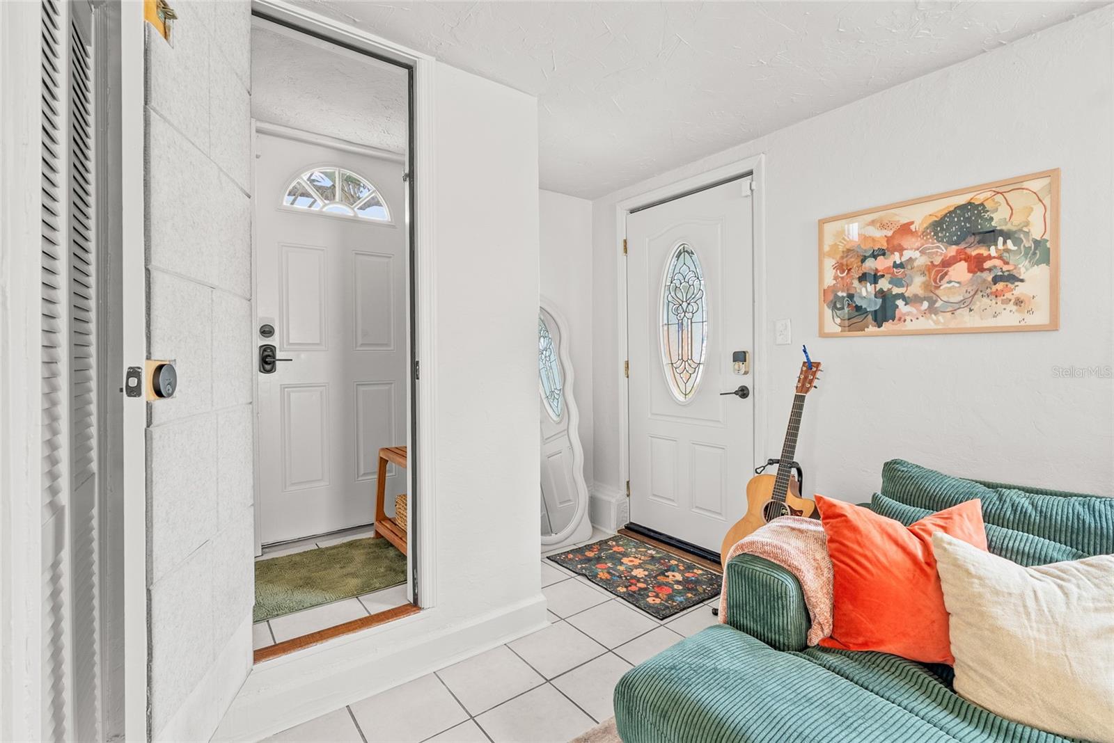 door has locks and gives access to the 2nd floor staircase that takes you to the top unit. 2nd floor also has its own exterior entrance.