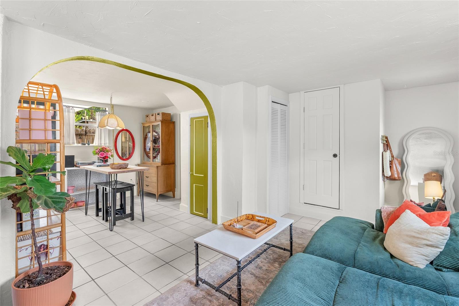 door on left has locks and gives access to the 2nd floor staircase that takes you to the top unit.