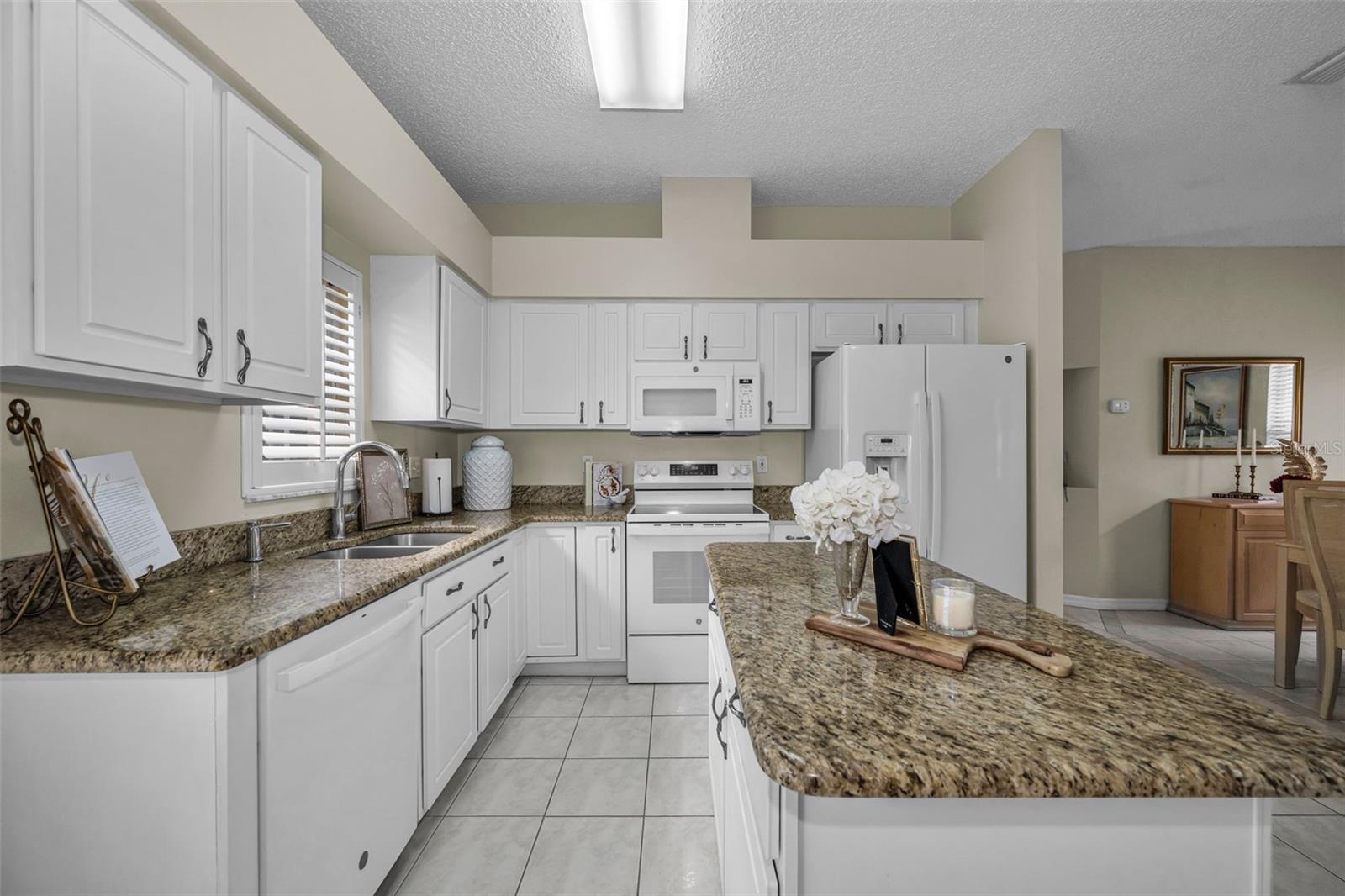 Granite counters compliment the white cabinetry
