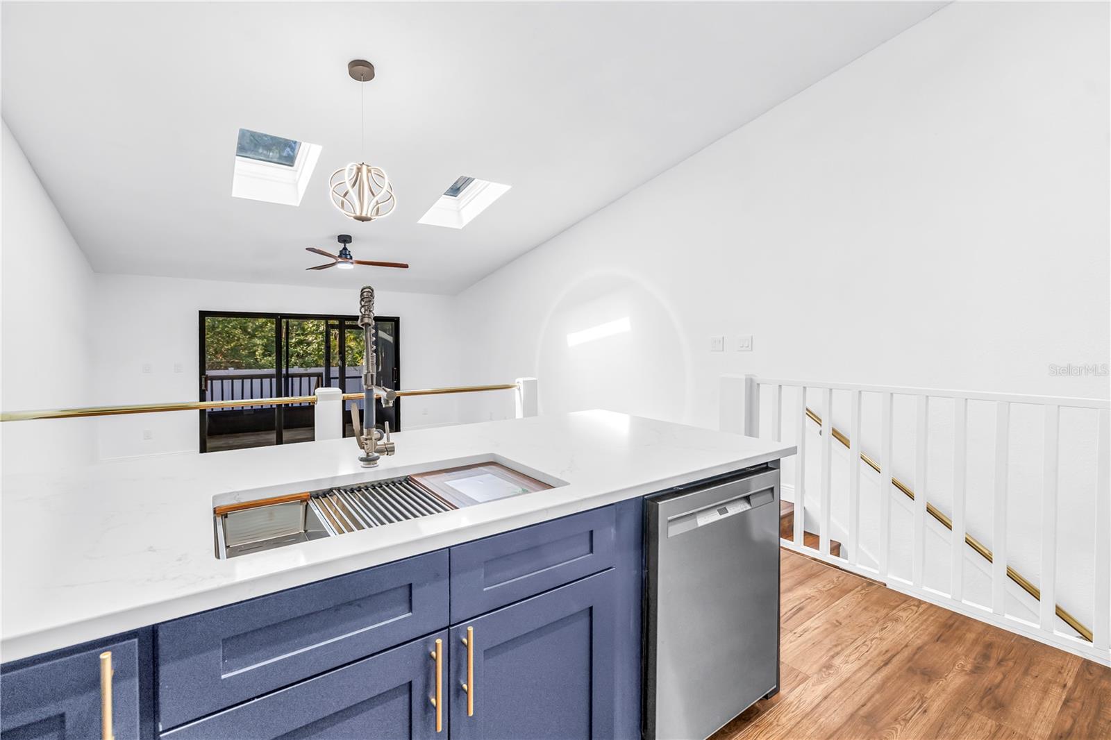 Kitchen overlooking Dining/ Living Room
