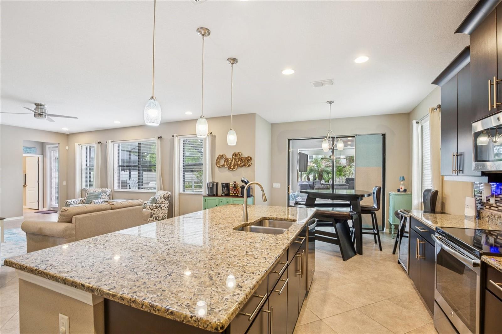 KITCHEN WITH OVER SIZED ISLAND ADDS ADDITIONAL SPACE FRO SEATING AND STORAGE!