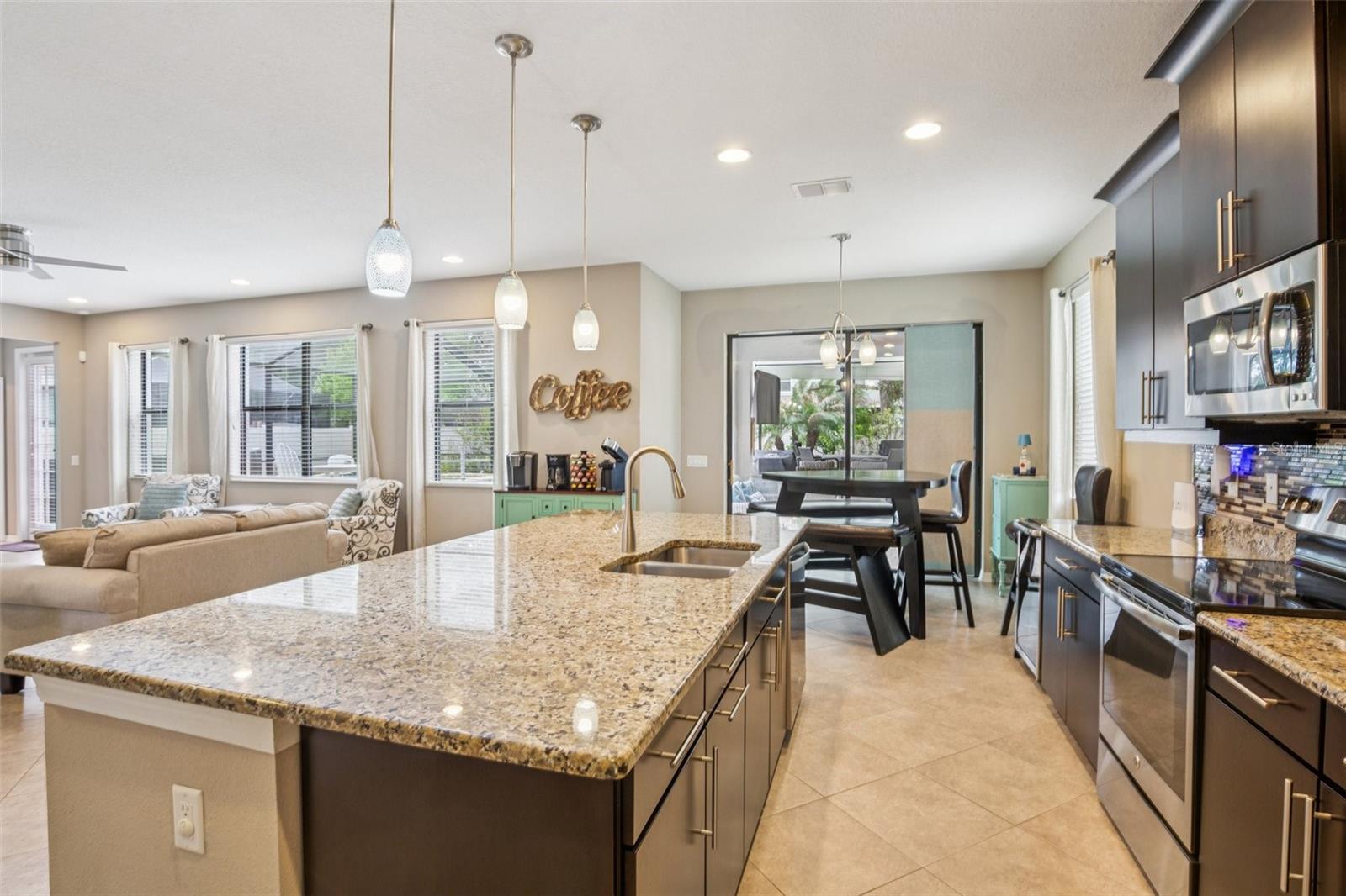 KITCHEN WITH OVER SIZED ISLAND ADDS ADDITIONAL SPACE FOR SEATING AND STORAGE!