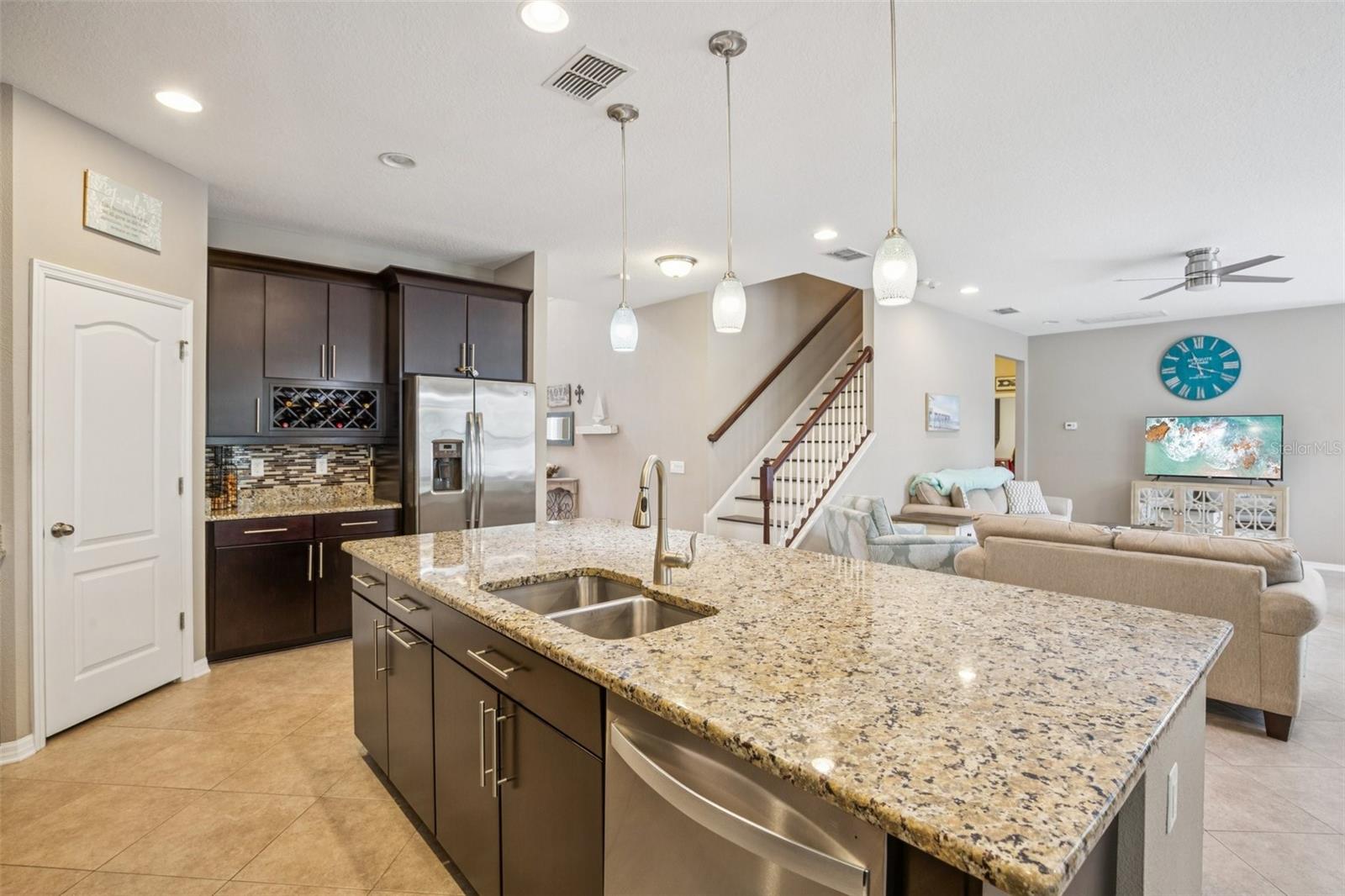 CUSTOM WINE STORAGE PROVIDES A GREAT SPOT FOR GATHERING AND ENTERTAINING