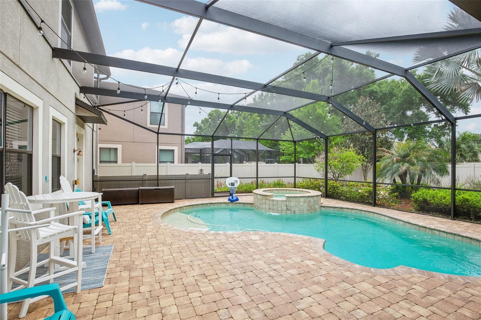SCREENED POOL AND SPA PROVIDES TRUE FLORIDA LIVING!