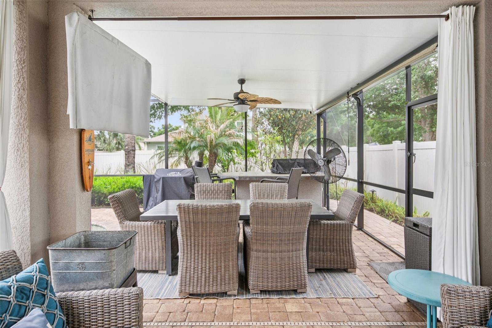 COVERED AND SCREENED LANAI WITH BUILT IN KITCHEN GIVES THE GRILL MASTER FULL CONTROL!