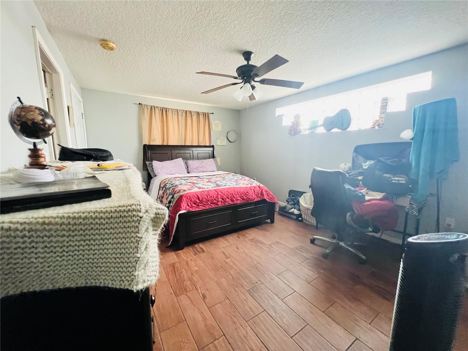 PRIMARY BEDROOM VIEW FROM BATHROOM