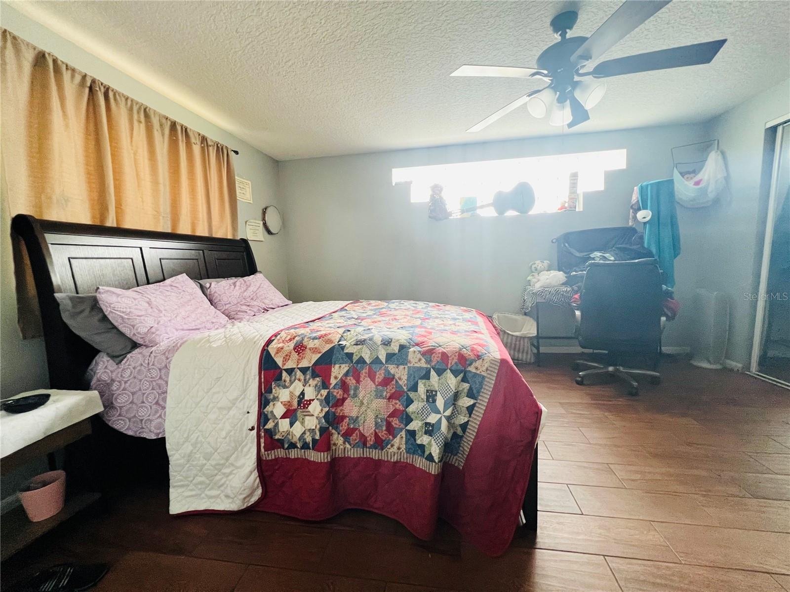 PRIMARY BEDROOM VIEW FROM KITCHEN AREA
