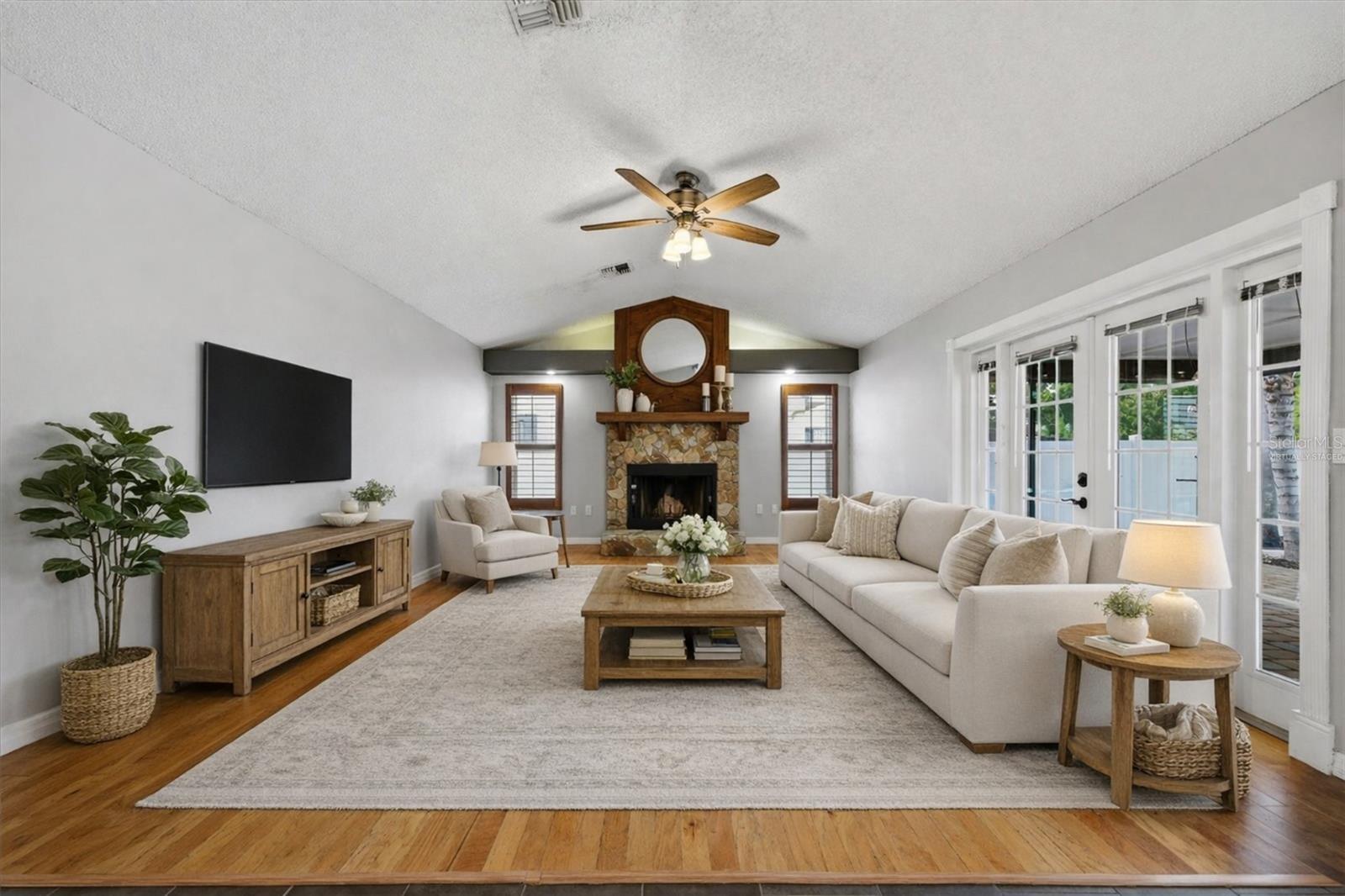 Virtually Staged: Living Room with Fireplace and Vaulted Ceilings