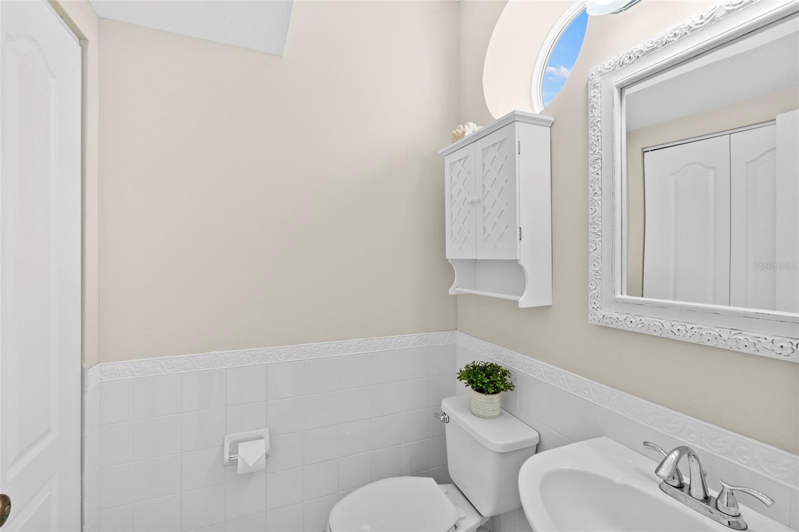 The main living level has a powder bath with linen closet for additional storage.