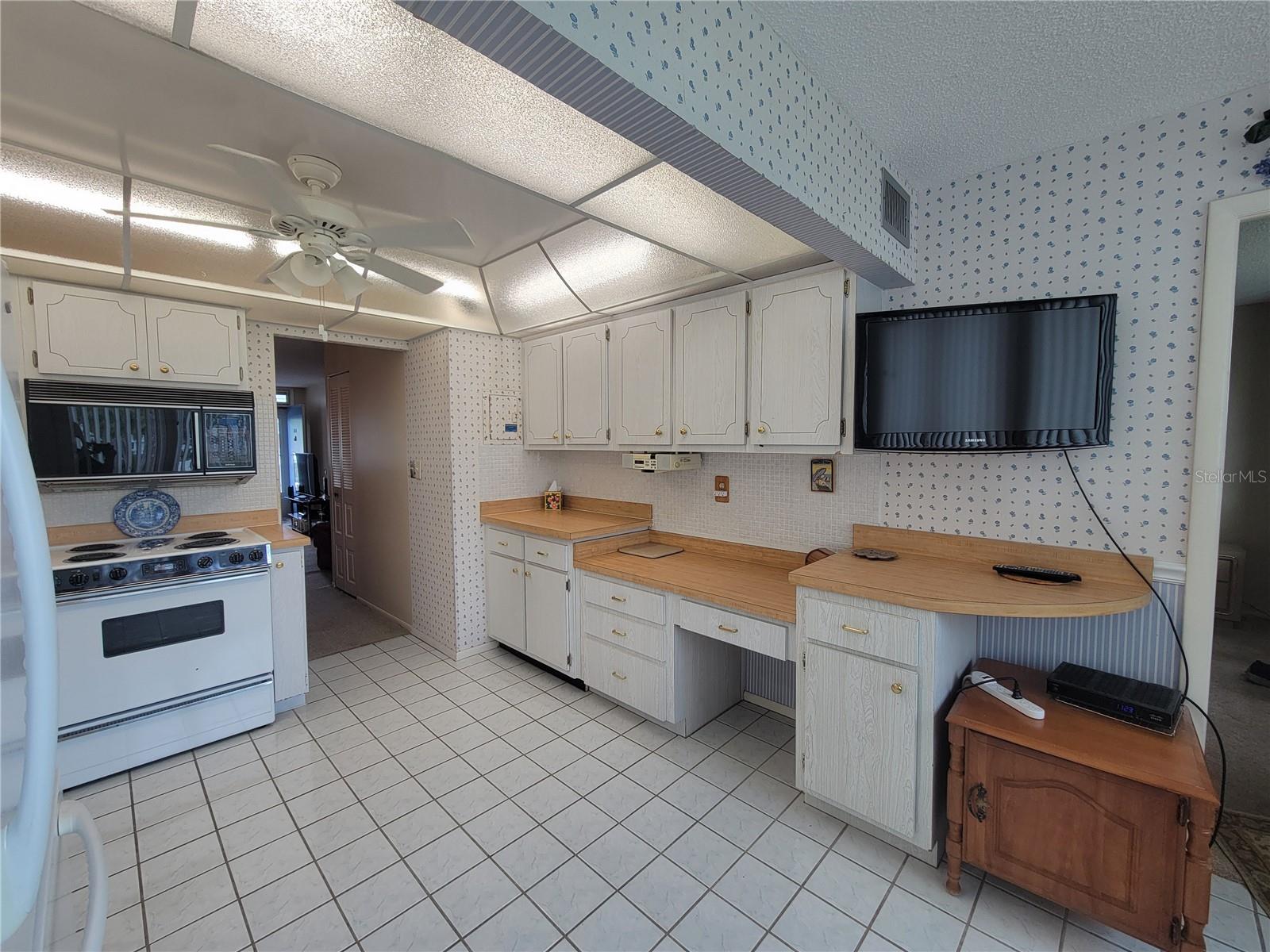 This kitchen features abundant counter space for prepwork
