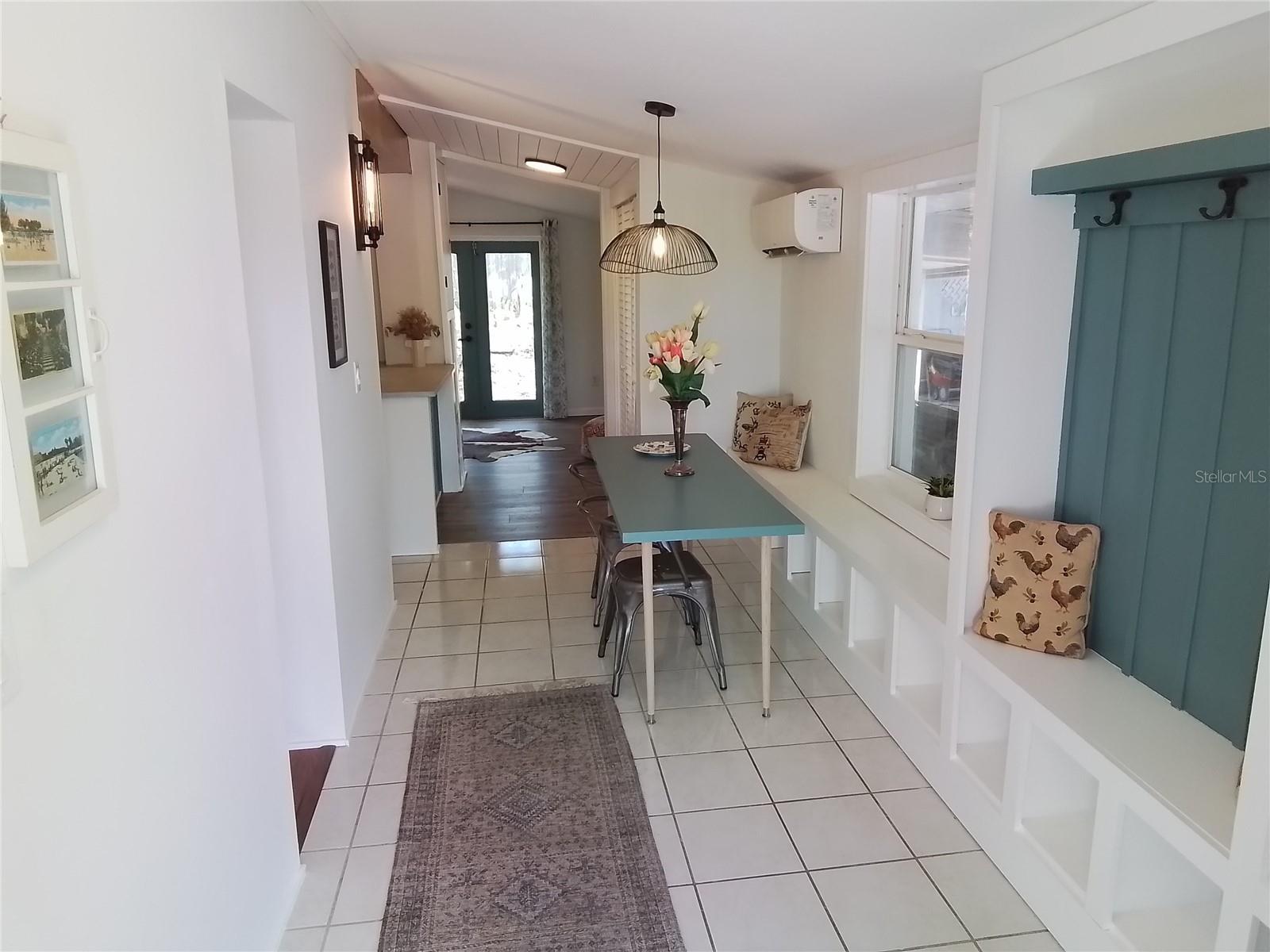 Foyer and dining area with built-ins