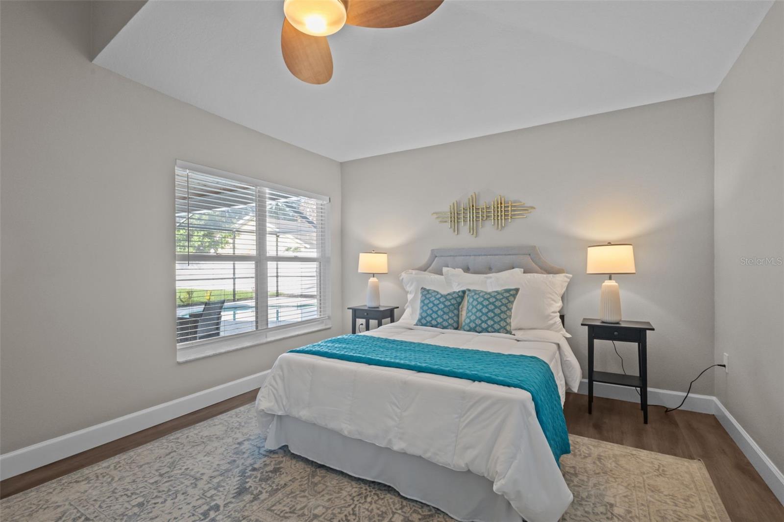 Primary suite overlooking pool