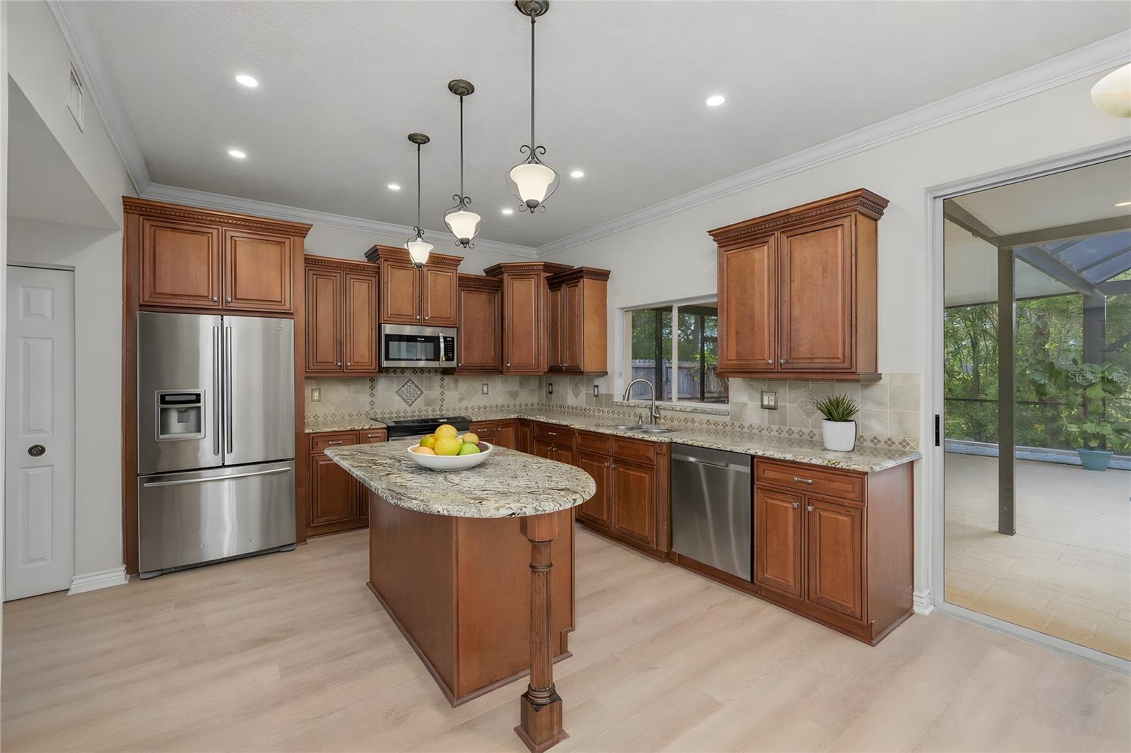 Chef's kitchen with granite tops and a view!