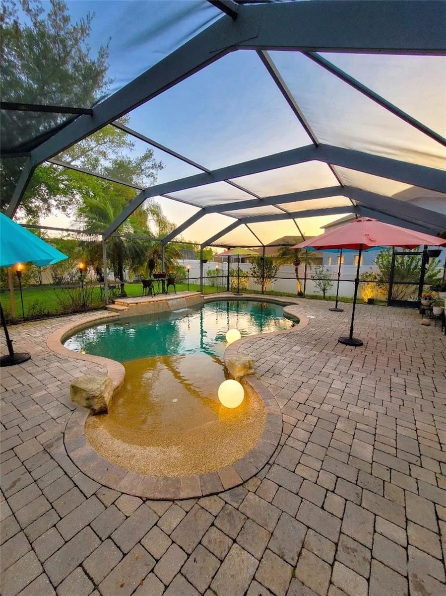 Beach entry pool and water fountain feature