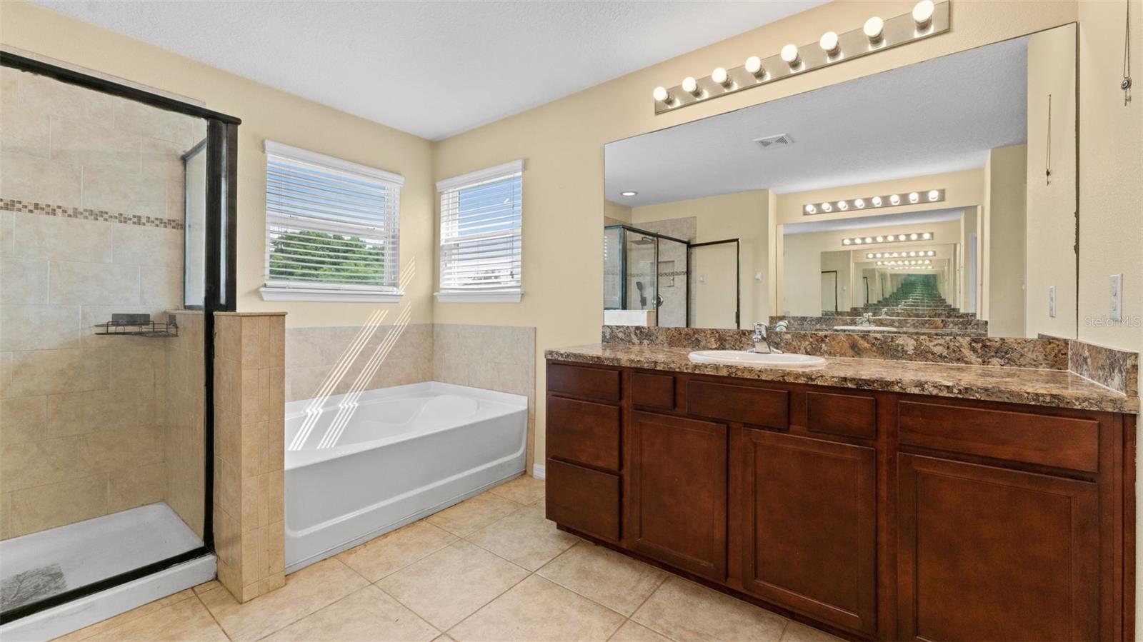 Primary Bathroom with 2 Separate vanities with storage
