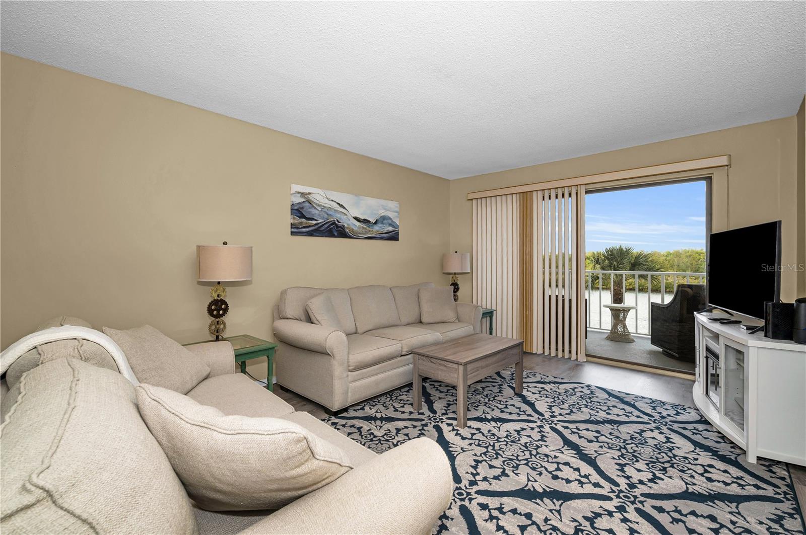 Living area looking out to the waterfront balcony