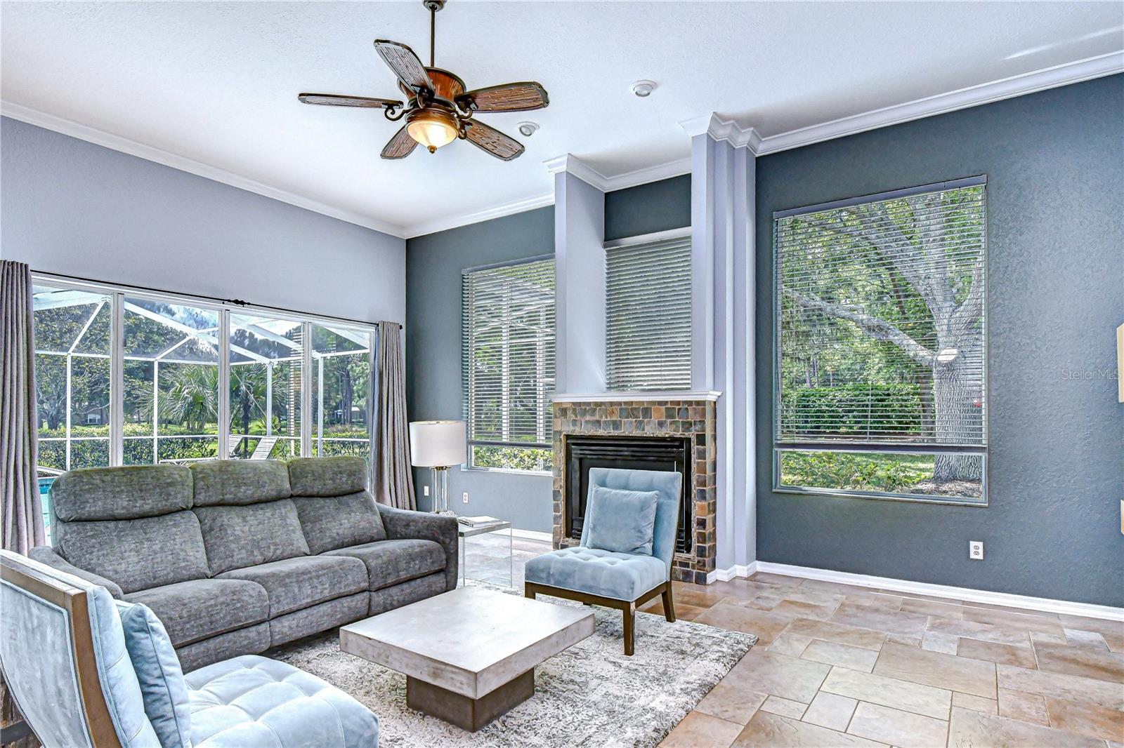 Expansive great room anchored by a cozy fireplace